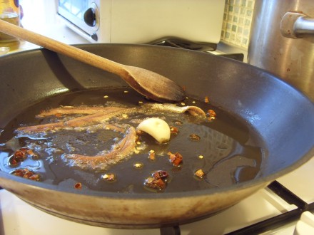 Frying the anchovies and chilli